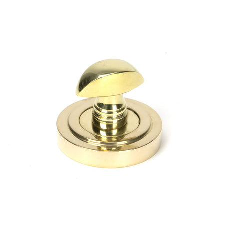 This is an image showing From The Anvil - Polished Brass Round Thumbturn Set (Art Deco) available from trade door handles, quick delivery and discounted prices