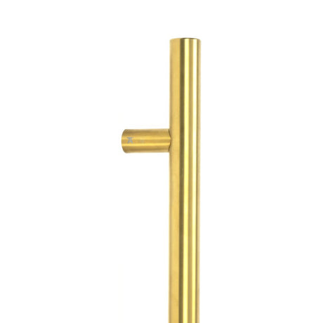 This is an image showing From The Anvil - Aged Brass (316) 0.6m T Bar Handle Bolt Fix 32mm Ã˜ available from trade door handles, quick delivery and discounted prices