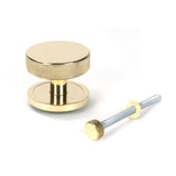 This is an image showing From The Anvil - Polished Brass Brompton Centre Door Knob (Plain) available from trade door handles, quick delivery and discounted prices