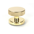 This is an image showing From The Anvil - Polished Brass Brompton Centre Door Knob (Art Deco) available from trade door handles, quick delivery and discounted prices