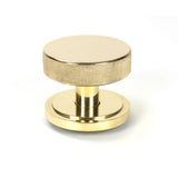 This is an image showing From The Anvil - Polished Brass Brompton Centre Door Knob (Art Deco) available from trade door handles, quick delivery and discounted prices