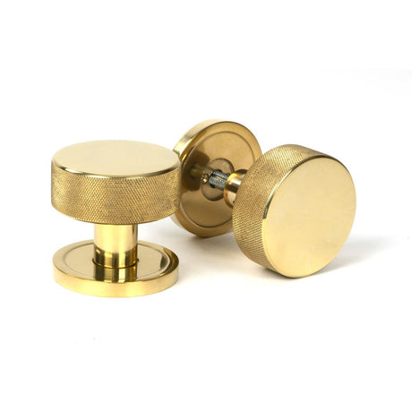 This is an image showing From The Anvil - Polished Brass Brompton Mortice/Rim Knob Set Knob (Plain) available from trade door handles, quick delivery and discounted prices