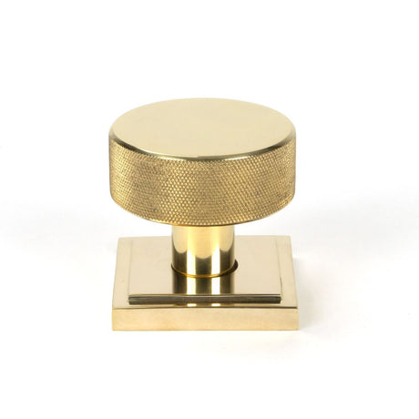 This is an image showing From The Anvil - Polished Brass Brompton Mortice/Rim Knob Set Knob (Square) available from trade door handles, quick delivery and discounted prices