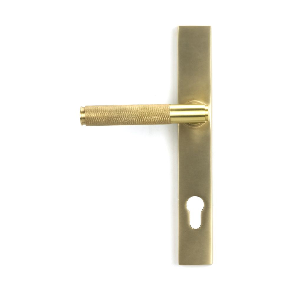 This is an image showing From The Anvil - Satin Brass Brompton Slimline Lever Espag. Lock Set available from trade door handles, quick delivery and discounted prices