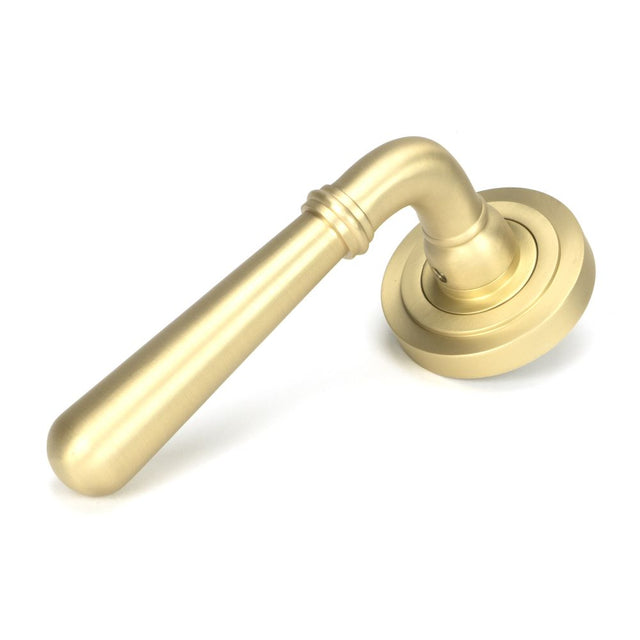 This is an image showing From The Anvil - Satin Brass Newbury Lever on Rose Set (Art Deco) available from trade door handles, quick delivery and discounted prices