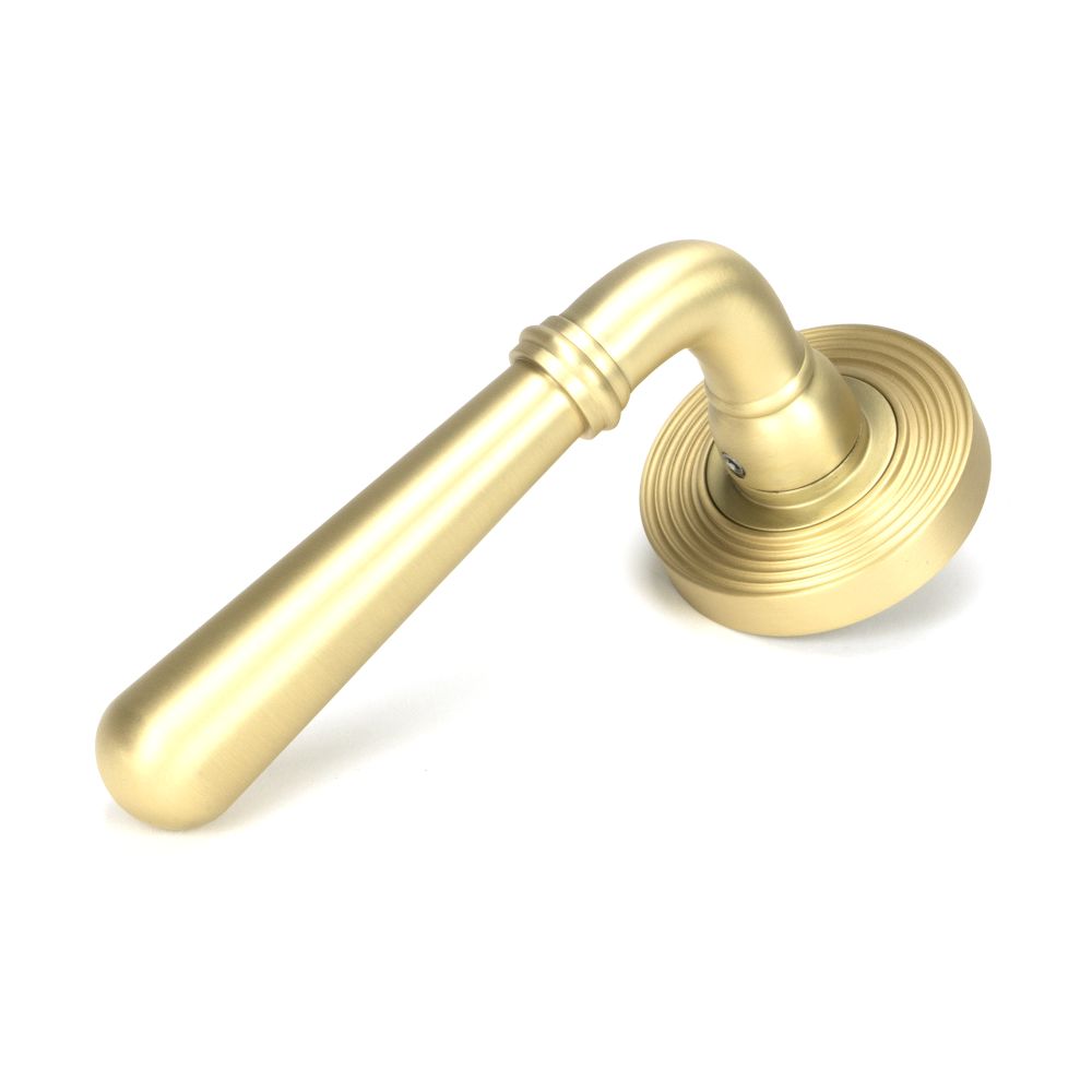 This is an image showing From The Anvil - Satin Brass Newbury Lever on Rose Set (Beehive) available from trade door handles, quick delivery and discounted prices