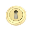 This is an image showing From The Anvil - Satin Brass Round Escutcheon (Art Deco) available from trade door handles, quick delivery and discounted prices