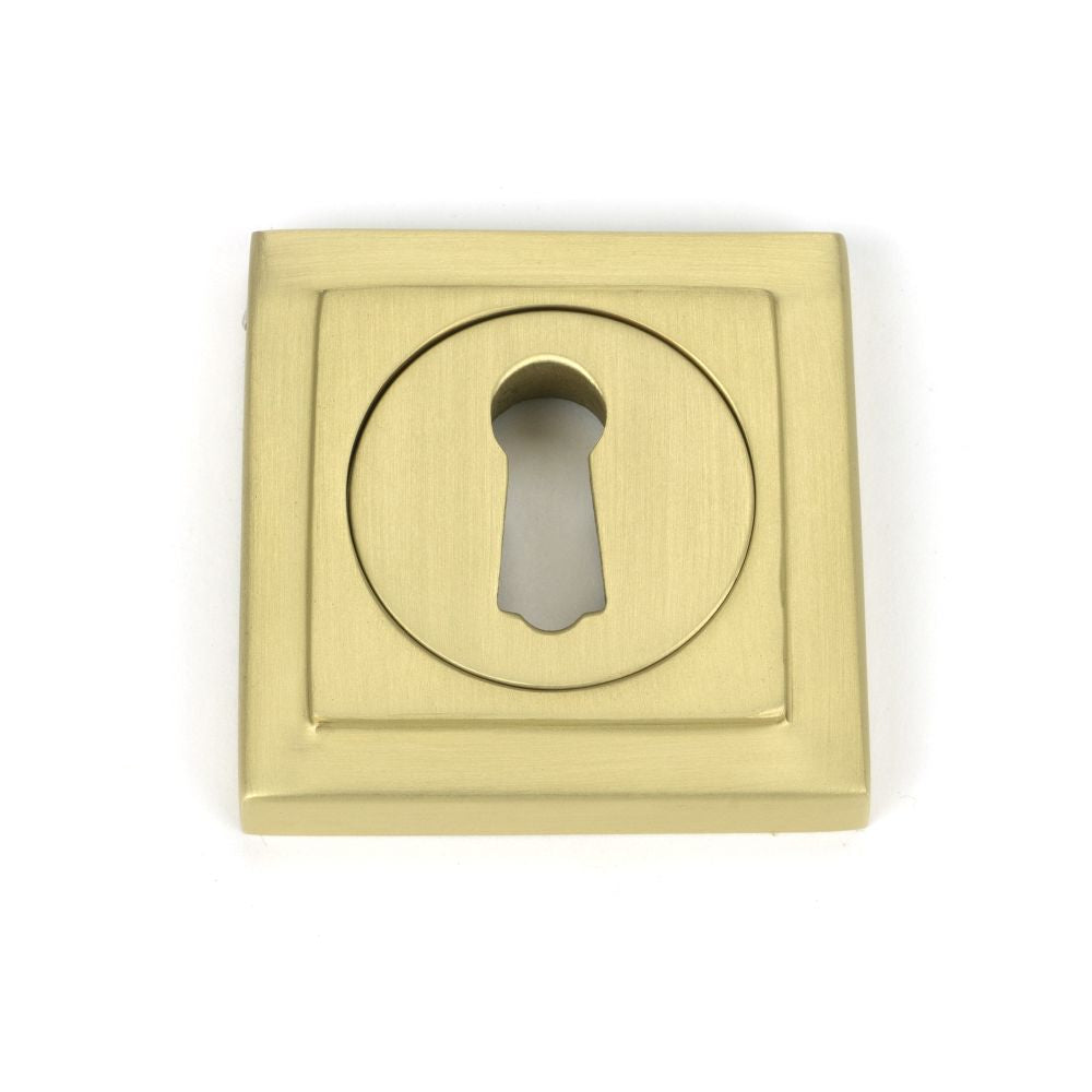 This is an image showing From The Anvil - Satin Brass Round Escutcheon (Square) available from trade door handles, quick delivery and discounted prices