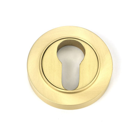 This is an image showing From The Anvil - Satin Brass Round Euro Escutcheon (Plain) available from trade door handles, quick delivery and discounted prices