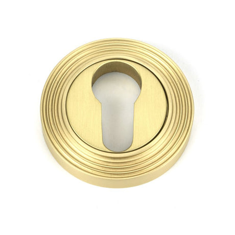 This is an image showing From The Anvil - Satin Brass Round Euro Escutcheon (Beehive) available from trade door handles, quick delivery and discounted prices