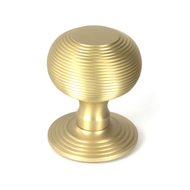 This is an image showing From The Anvil - Satin Brass Beehive Centre Door Knob available from trade door handles, quick delivery and discounted prices