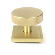 This is an image showing From The Anvil - Satin Brass Brompton Centre Door Knob (Square) available from trade door handles, quick delivery and discounted prices