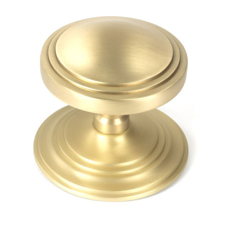 This is an image showing From The Anvil - Satin Brass Art Deco Centre Door Knob available from trade door handles, quick delivery and discounted prices