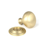 This is an image showing From The Anvil - Satin Brass Mushroom Cabinet Knob 32mm available from trade door handles, quick delivery and discounted prices