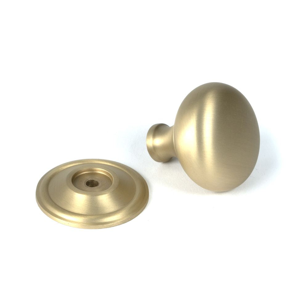 This is an image showing From The Anvil - Satin Brass Mushroom Cabinet Knob 38mm available from trade door handles, quick delivery and discounted prices