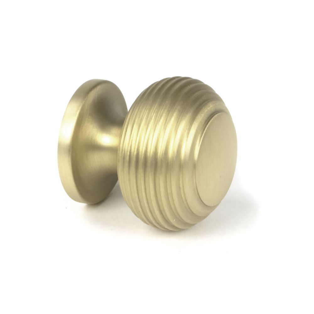 This is an image showing From The Anvil - Satin Brass Beehive Cabinet Knob 30mm available from trade door handles, quick delivery and discounted prices