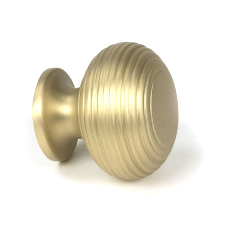 This is an image showing From The Anvil - Satin Brass Beehive Cabinet Knob 40mm available from trade door handles, quick delivery and discounted prices