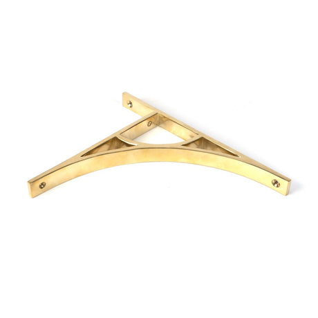 This is an image showing From The Anvil - Polished Brass Tyne Shelf Bracket (260mm x 200mm) available from trade door handles, quick delivery and discounted prices