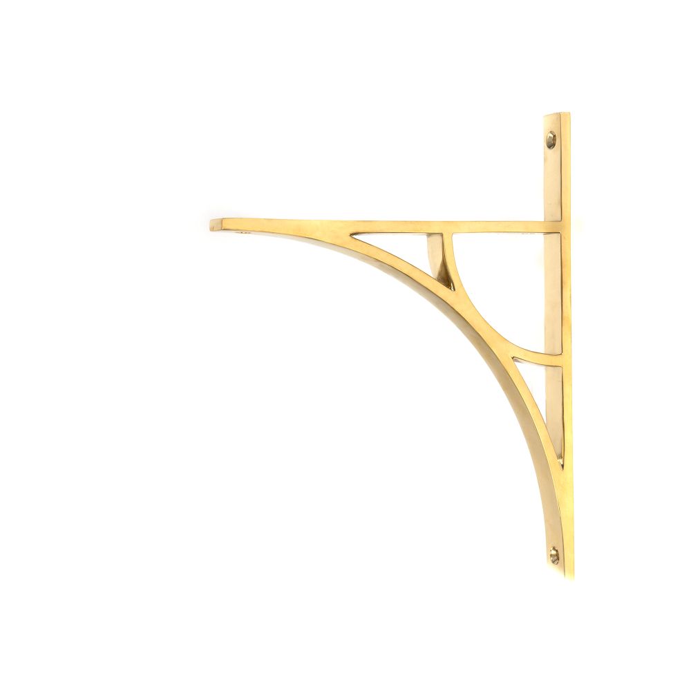 This is an image showing From The Anvil - Polished Brass Tyne Shelf Bracket (260mm x 200mm) available from trade door handles, quick delivery and discounted prices