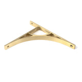 This is an image showing From The Anvil - Satin Brass Tyne Shelf Bracket (260mm x 200mm) available from trade door handles, quick delivery and discounted prices