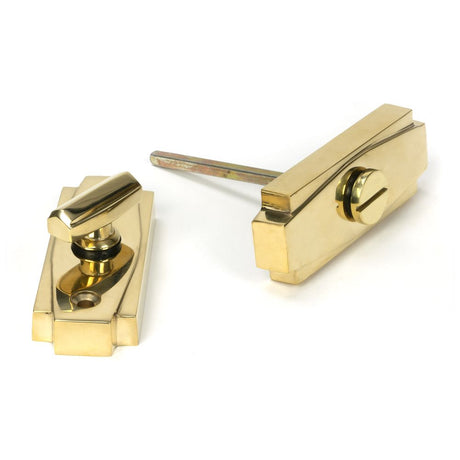 This is an image showing From The Anvil - Polished Brass Art Deco Thumbturn available from trade door handles, quick delivery and discounted prices