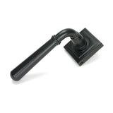 This is an image showing From The Anvil - Matt Black Newbury Lever on Rose Set (Square) - Unsprung available from trade door handles, quick delivery and discounted prices