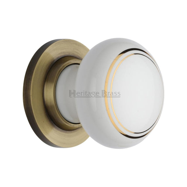 This is an image of a Heritage Brass - Gold Line Knob with Antique Brass base, 6010-at that is available to order from Trade Door Handles in Kendal.