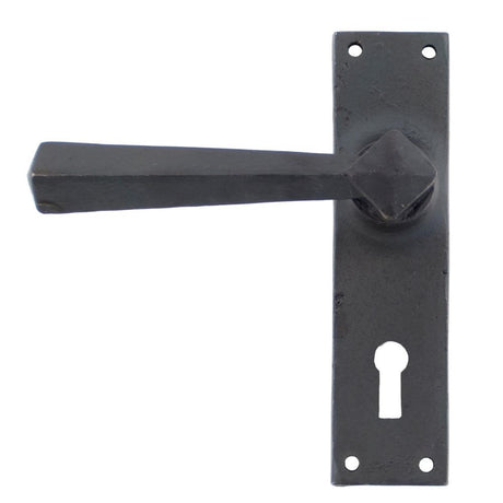 This is an image showing From The Anvil - Beeswax Straight Lever Lock Set available from trade door handles, quick delivery and discounted prices