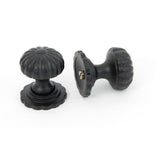 This is an image showing From The Anvil - Black Flower Cabinet Knob - Small available from trade door handles, quick delivery and discounted prices