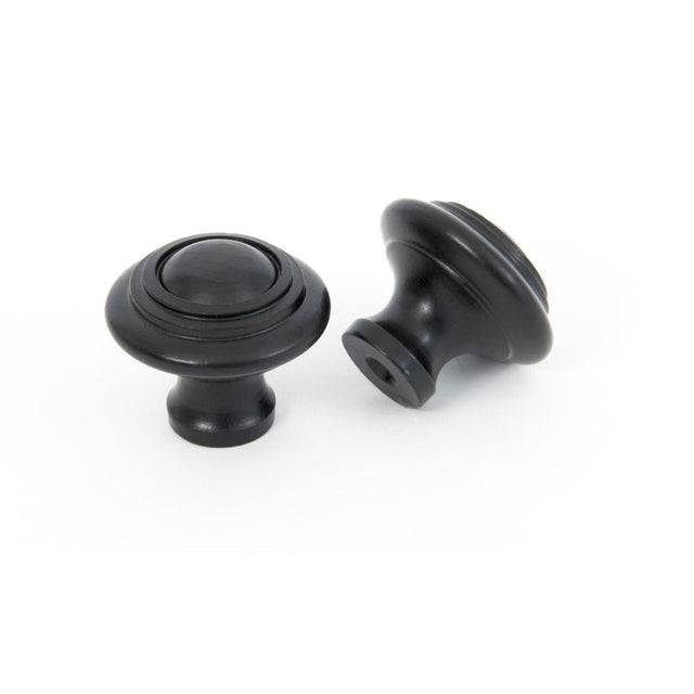This is an image showing From The Anvil - Black Ringed Cabinet Knob - Small available from trade door handles, quick delivery and discounted prices