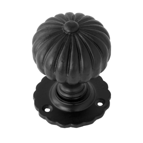 This is an image showing From The Anvil - Black Flower Mortice Knob Set available from trade door handles, quick delivery and discounted prices