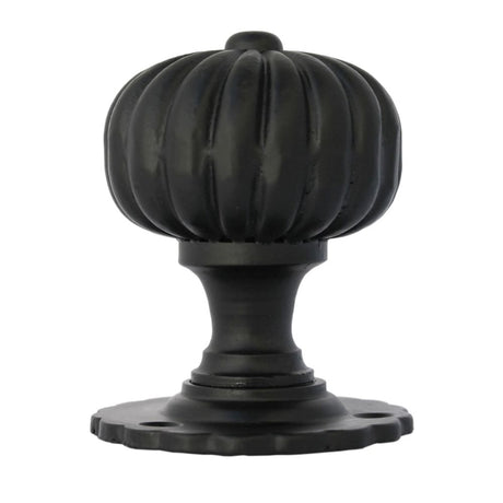 This is an image showing From The Anvil - Black Flower Mortice Knob Set available from trade door handles, quick delivery and discounted prices