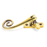 This is an image showing From The Anvil - Aged Brass Monkeytail Fastener available from trade door handles, quick delivery and discounted prices