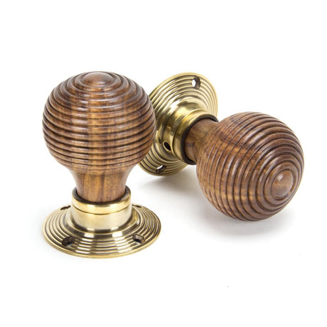 This is an image showing From The Anvil - Rosewood & Aged Brass Beehive Mortice/Rim Knob Set available from trade door handles, quick delivery and discounted prices