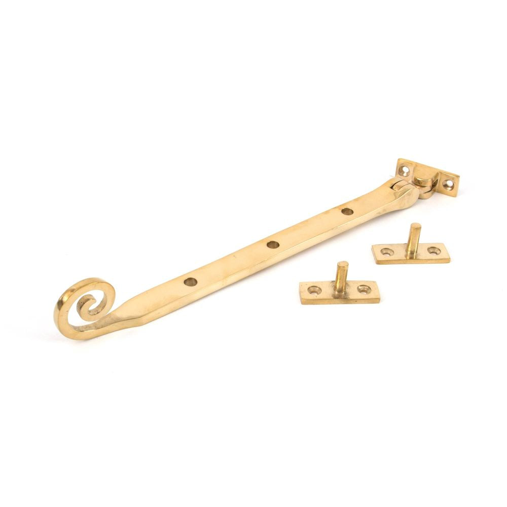 This is an image showing From The Anvil - Polished Brass 10" Monkeytail Stay available from trade door handles, quick delivery and discounted prices