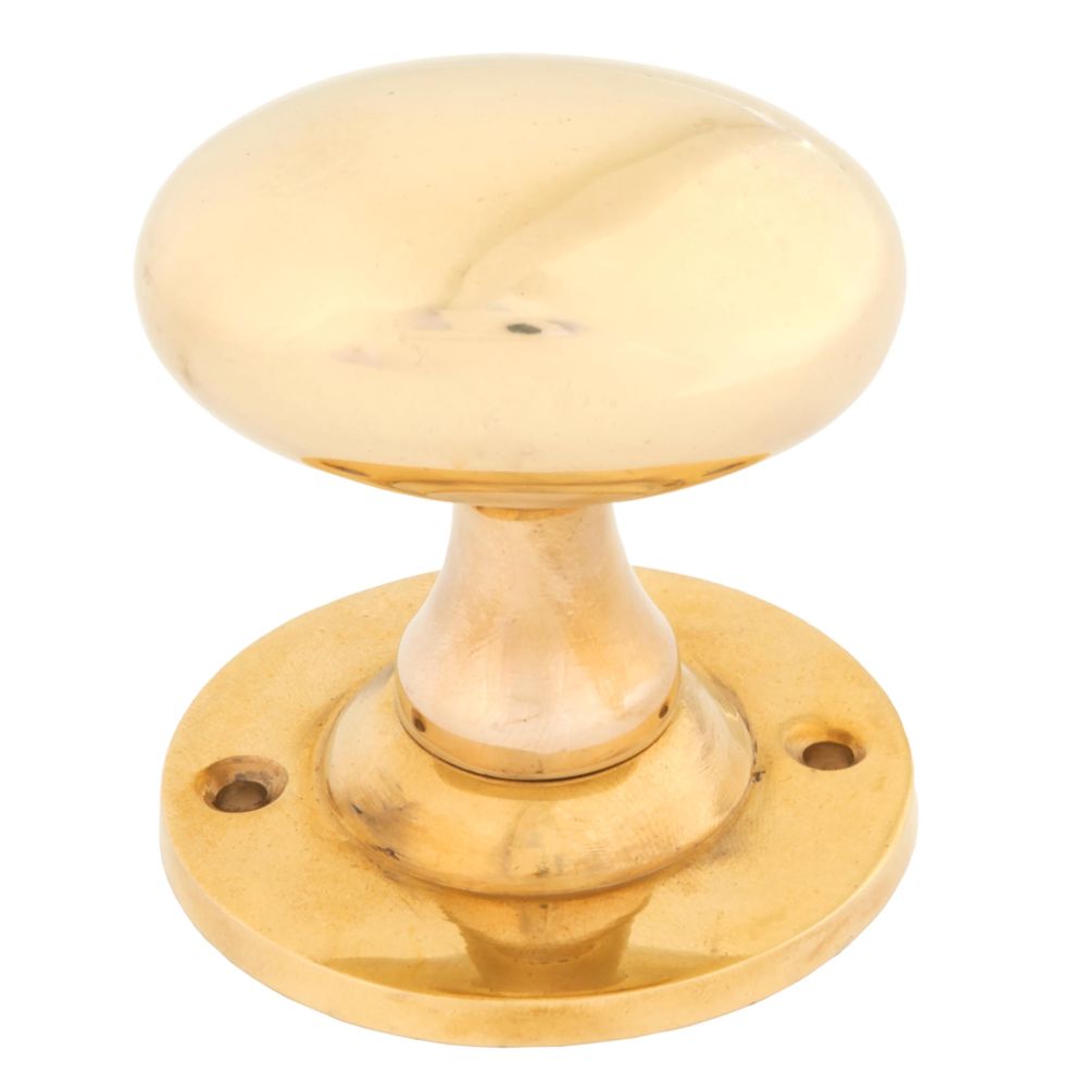 This is an image showing From The Anvil - Polished Brass Oval Mortice/Rim Knob Set available from trade door handles, quick delivery and discounted prices