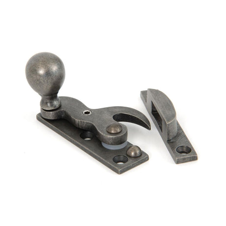 This is an image showing From The Anvil - Antique Pewter Sash Hook Fastener available from trade door handles, quick delivery and discounted prices