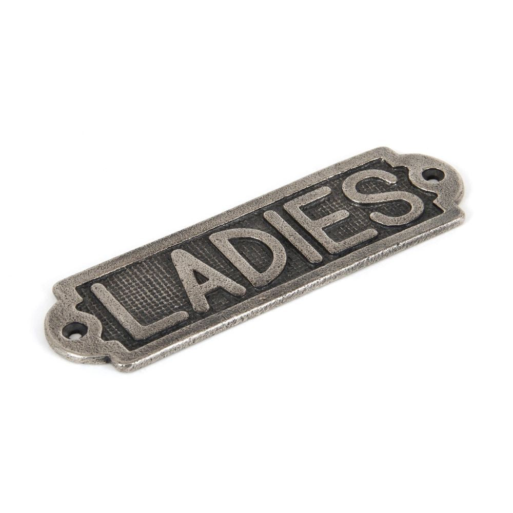 This is an image showing From The Anvil - Antique Pewter Ladies Sign available from trade door handles, quick delivery and discounted prices