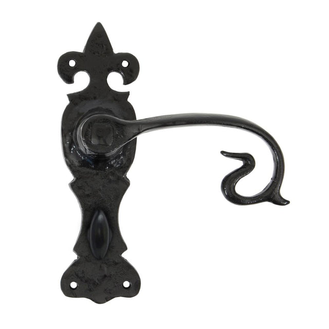 This is an image showing From The Anvil - Black Curly Lever Bathroom Set available from trade door handles, quick delivery and discounted prices