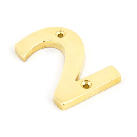 This is an image showing From The Anvil - Polished Brass Numeral 2 available from trade door handles, quick delivery and discounted prices