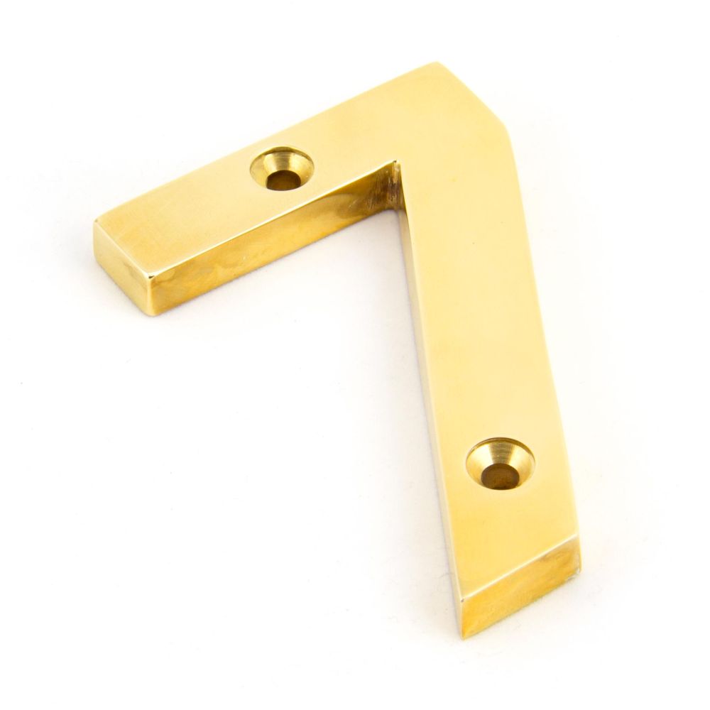 This is an image showing From The Anvil - Polished Brass Numeral 7 available from trade door handles, quick delivery and discounted prices