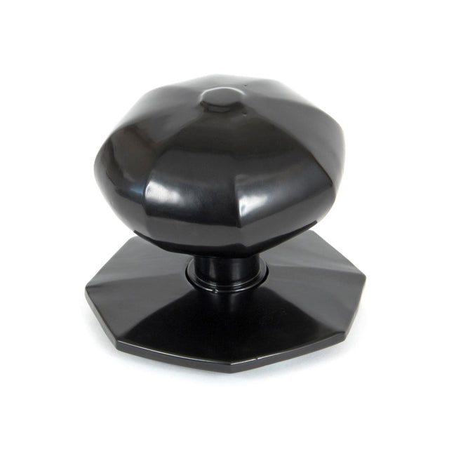 This is an image showing From The Anvil - Black Octagonal Centre Door Knob available from trade door handles, quick delivery and discounted prices