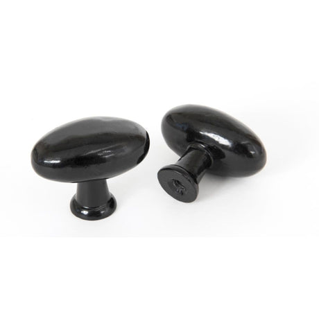 This is an image showing From The Anvil - Black Oval Cabinet Knob available from trade door handles, quick delivery and discounted prices