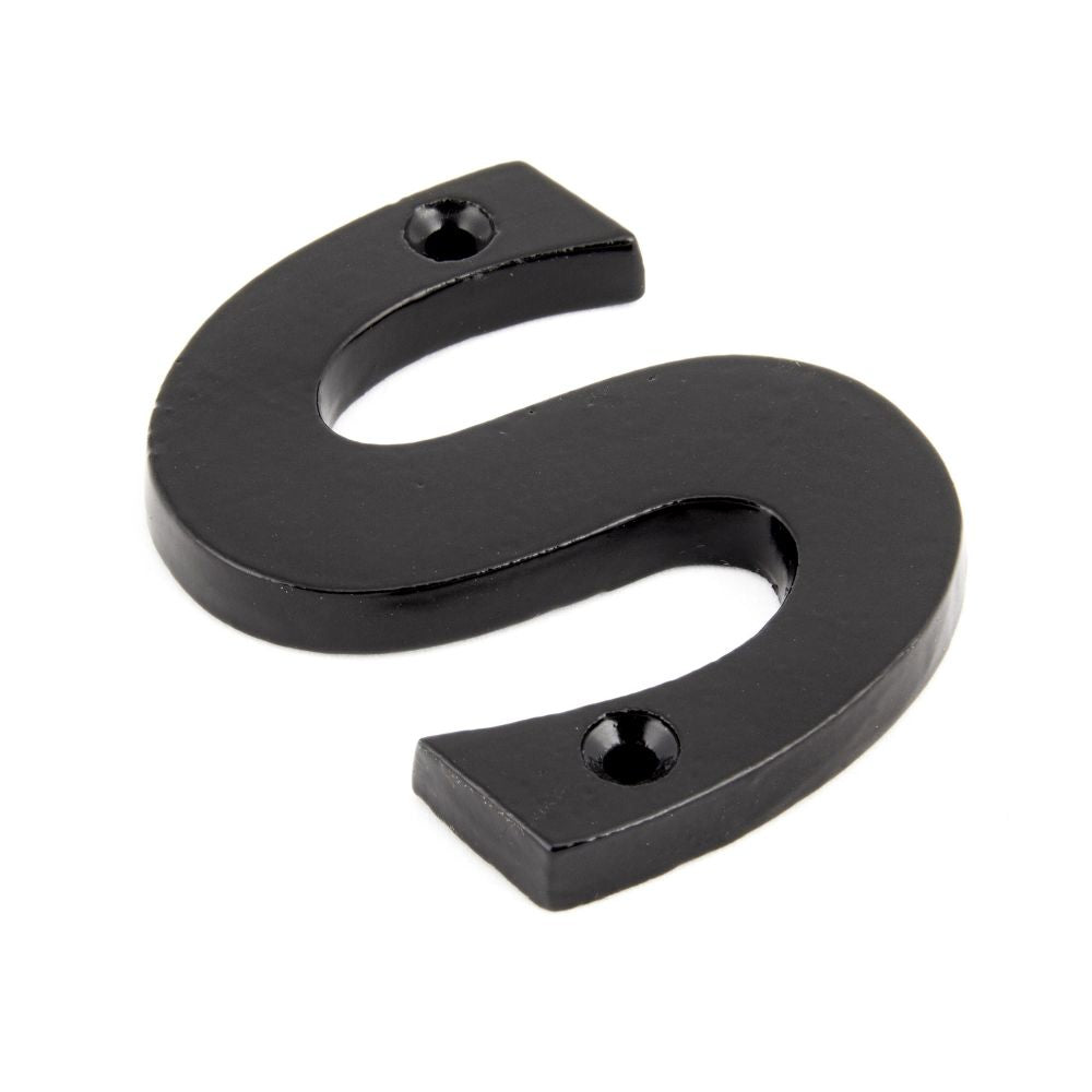 This is an image showing From The Anvil - Black Letter S available from trade door handles, quick delivery and discounted prices