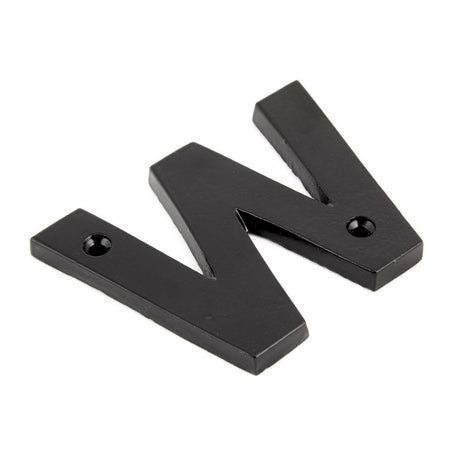 This is an image showing From The Anvil - Black Letter W available from trade door handles, quick delivery and discounted prices