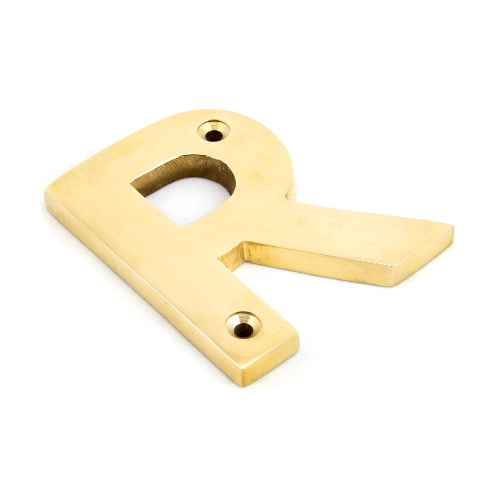 This is an image showing From The Anvil - Polished Brass Letter R available from trade door handles, quick delivery and discounted prices