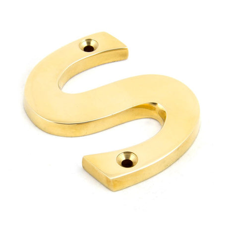 This is an image showing From The Anvil - Polished Brass Letter S available from trade door handles, quick delivery and discounted prices