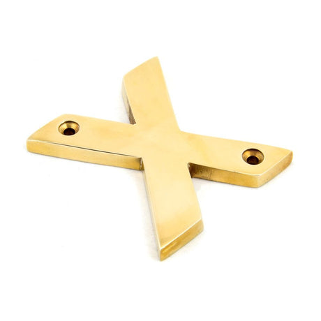 This is an image showing From The Anvil - Polished Brass Letter X available from trade door handles, quick delivery and discounted prices