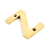 This is an image showing From The Anvil - Polished Brass Letter Z available from trade door handles, quick delivery and discounted prices