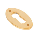 This is an image showing From The Anvil - Polished Brass Oval Escutcheon available from trade door handles, quick delivery and discounted prices